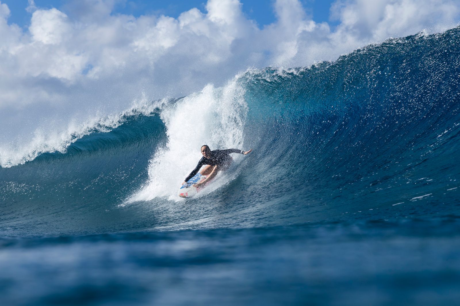 Carissa Moore driving down the face of a breaking wave